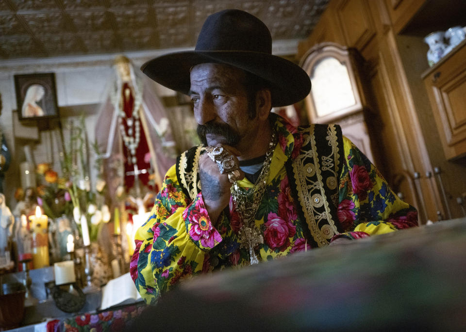Zoltan Sztojka, traditional Gypsy fortune-teller is seen in his home in Soltvadkert, central Hungary on Oct. 10, 2021. Sztojka, by his own account Hungary’s last Roma fortuneteller, is working to preserve his culture's traditions that are slowly vanishing in the Central European country. (AP Photo/Bela Szandelszky)