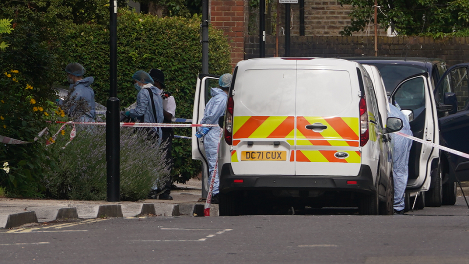 Police and forensic officers and at an address in Shepherd's Bush, west London, after human remains were found in two suitcases near the Clifton Suspension Bridge in Bristol