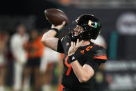 Miami quarterback Tyler Van Dyke throws a pass during the first half of the team's NCAA college football game against North Carolina State, Saturday, Oct. 23, 2021, in Miami Gardens, Fla. (AP Photo/Wilfredo Lee)