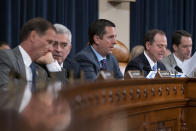 Rep. Devin Nunes, R-Calif, ranking member of the House Intelligence Committee, center, is joined by, from left, Rep. Chris Stewart, R-Utah, Rep. Brad Wenstrup, R-Ohio, Chairman Adam Schiff, D-Calif., and Rep. Jim Himes, D-Conn., during a hearing on politically motivated fake videos and manipulated media, on Capitol Hill in Washington, Thursday, June 13, 2019. (AP Photo/J. Scott Applewhite)