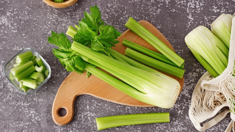 Celery on wooden cutting board