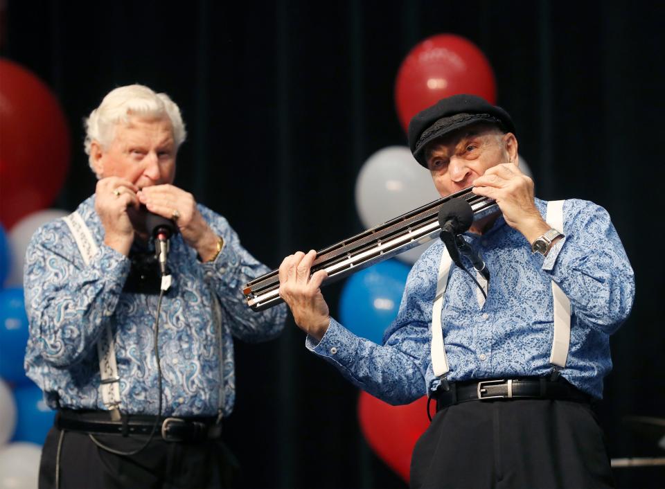 From left, Mo Vint and Bud Boblink perform with the Harmonicats during the Snowbird Extravaganza at the RP Funding Center in Lakeland in 2020.