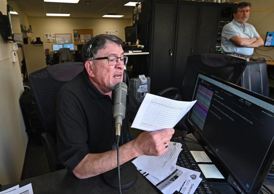 Charlotte Knights public address announcer Ken Conrad the team’s starters for their home opener against the Norfolk Tides on Tuesday, April 2, 2024 at Truist Field in Charlotte, NC. Conrad has been with the team for 23-years.