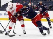 Columbus Blue Jackets defenseman Seth Jones, front right, checks Detroit Red Wings forward Sam Gagner during the first period of an NHL hockey game in Columbus, Ohio, Saturday, May 8, 2021. (AP Photo/Paul Vernon)