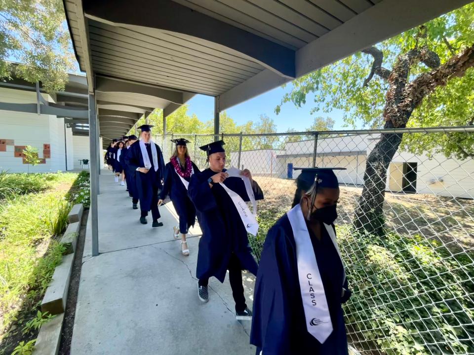 Graduates from Century Academy in Thousand Oaks file toward the school's multipurpose room for the commencement Tuesday, June 7, 2022.