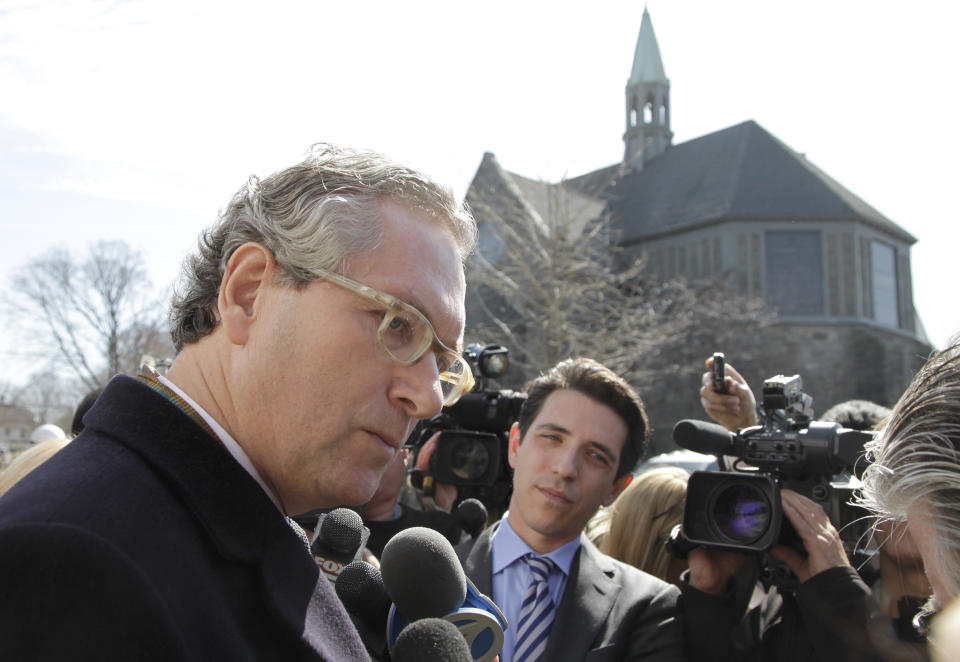 John Witherow, editor of the Sunday Times, talks with reporters after attending the funeral service for journalist Marie Colvin, Monday, March 12, 2012 at St. Dominic Roman Catholic Church in Oyster Bay, N.Y. The 56-year-old Colvin was a longtime reporter for Britain's Sunday Times. She and French photographer Remi Ochlik were killed Feb. 22 in shelling in Homs, Syria. (AP Photo/Mark Lennihan)