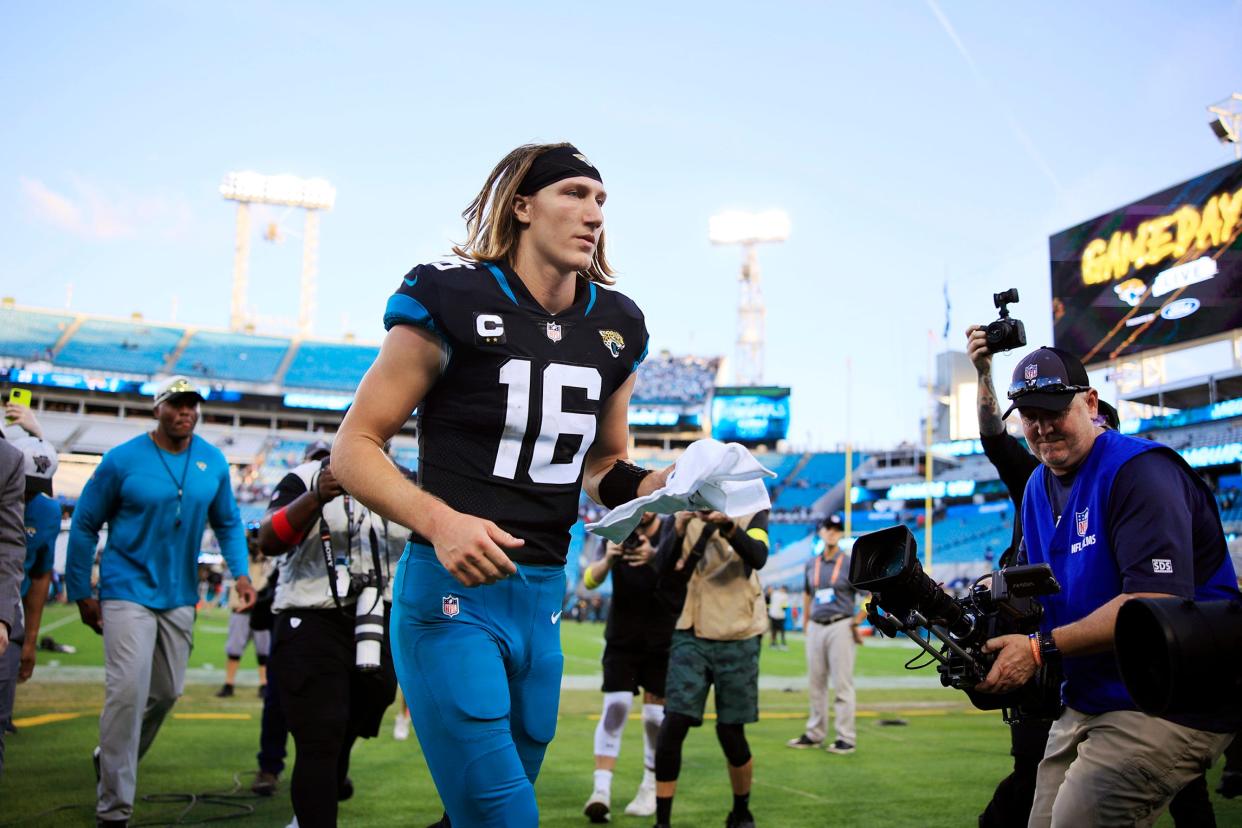 Jacksonville Jaguars quarterback Trevor Lawrence (16) runs into the locker room after the game of a regular season NFL football matchup Sunday, Nov. 27, 2022 at TIAA Bank Field in Jacksonville. The Jaguars edged the Ravens 28-27. [Corey Perrine/Florida Times-Union]
