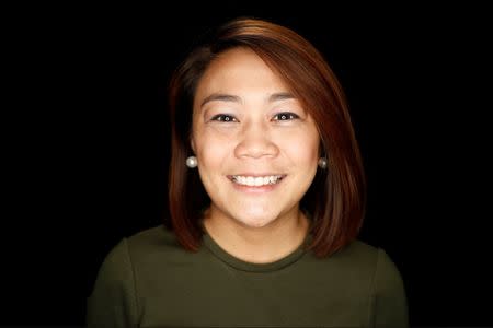 Thea Eustaquio from Manila, Philippines, poses for a portrait during a Canadian citizenship ceremony in Mississauga, Ontario, Canada, May 25, 2017. Eustaquio said: "I want to come to Canada because of wider job opportunities, high quality education, health benefits, visa free travel for almost all countries across the globe and multiculturalism. What I like best about Canada are the raw natural landscapes, parks, diversity and of course the food; maple syrup and BeaverTails!". REUTERS/Mark Blinch