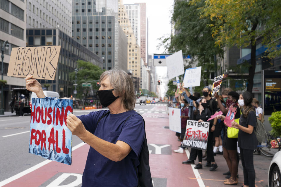 Housing advocates demonstrate outside the building which houses New York Gov. Andrew Cuomo's office, Monday, Sept. 28, 2020, in New York. The activists were demanding immediate safe and stable housing for all the people of New York and that the residential eviction moratorium be extended. (AP Photo/Mary Altaffer)