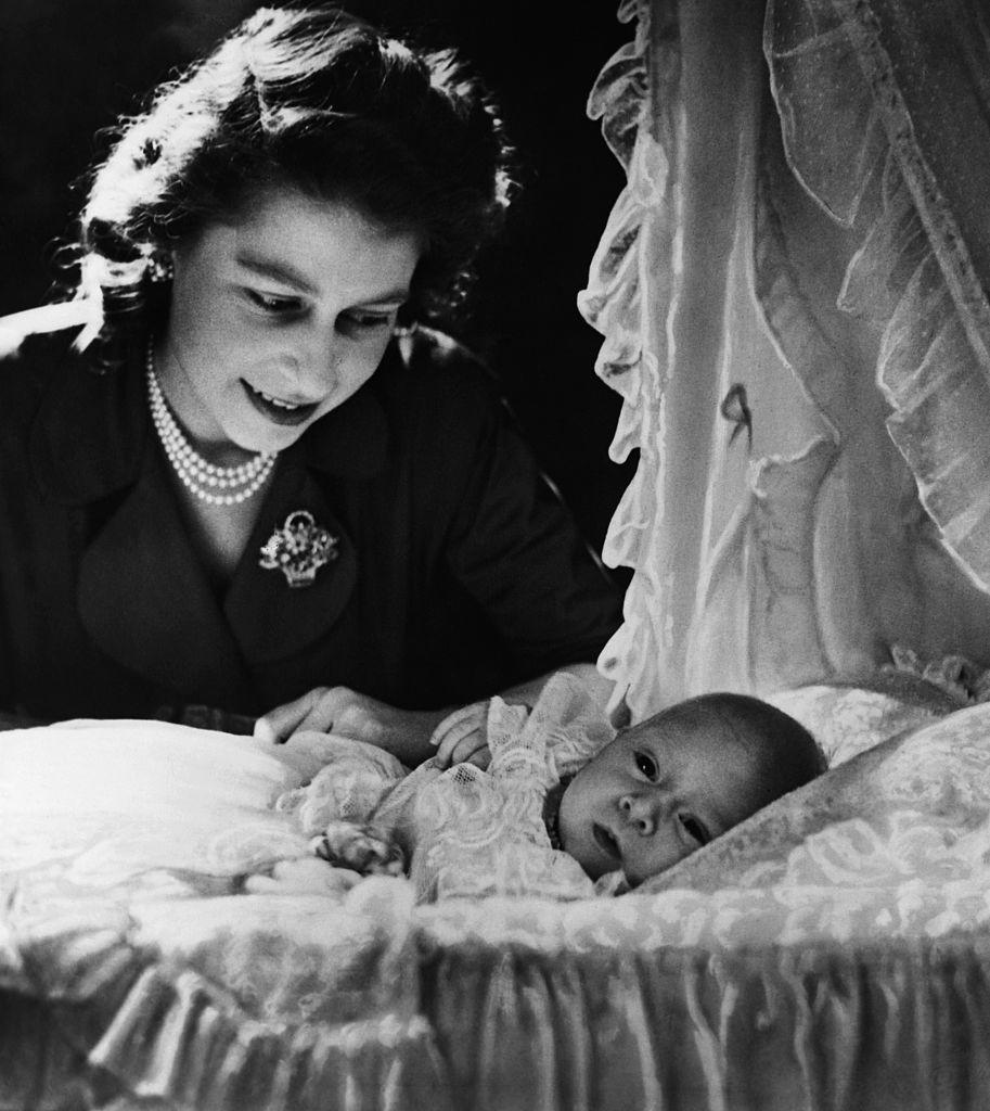 <p>Princess Elizabeth, future Queen Elizabeth II, is shown gazing at her month-old son Prince Charles. (Photo: Getty Images) </p>