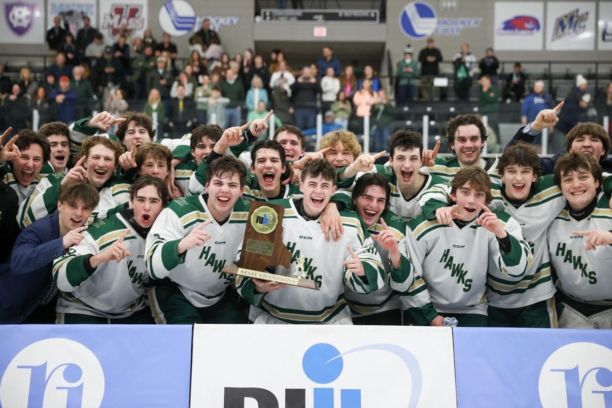 Hendricken celebrates Division I boys hockey state championship at Schneider Arena, over Burrillville, on Sunday.