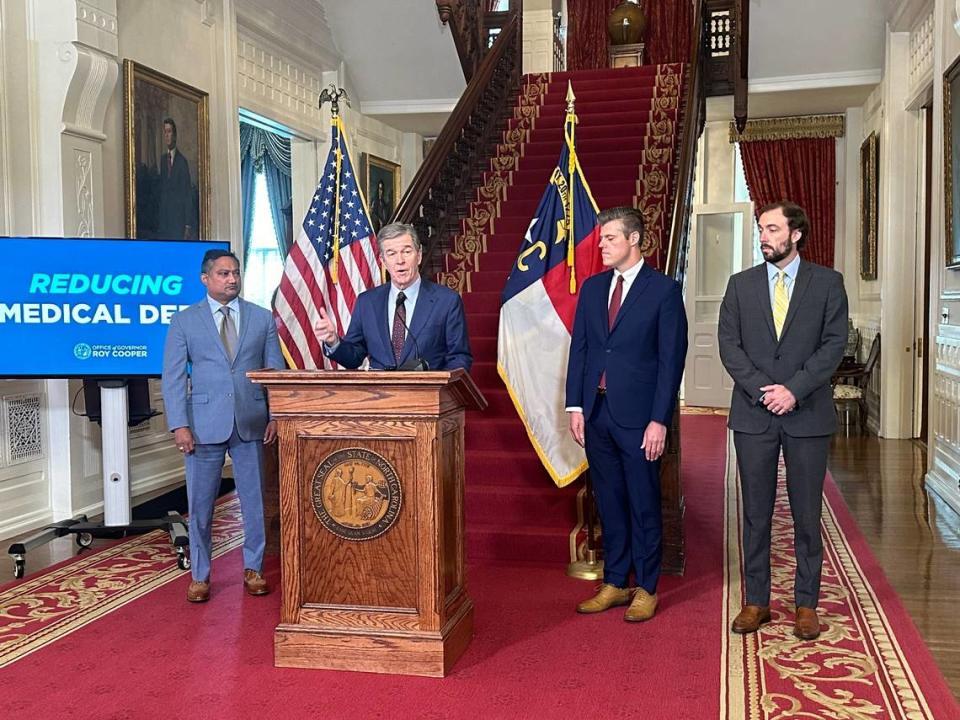 Gov. Roy Cooper and state Health and Human Services Secretary Kody Kinsley unveil a new proposal to cut medical debt in North Carolina. They were joined by John Broome with the American Cancer Society Cancer Action Network of North Carolina and Dave Almeida with the Leukemia & Lymphoma Society.