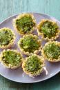 <p>Put a Greek spin on Christmas with these savory tartlets filled with spinach, feta cheese, and fresh dill.</p><p><em>Get the <a href="https://www.womansday.com/food-recipes/food-drinks/recipes/a39895/feta-spinach-tartlets-recipe-ghk0414/" rel="nofollow noopener" target="_blank" data-ylk="slk:Feta and Spinach Tartlets recipe;elm:context_link;itc:0;sec:content-canvas" class="link ">Feta and Spinach Tartlets recipe</a>.</em></p>