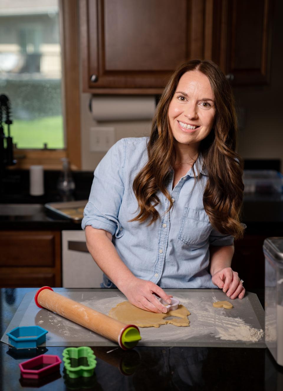 Jacqueline Brock makes Bitt of Sugar cookies at her West Des Moines home.