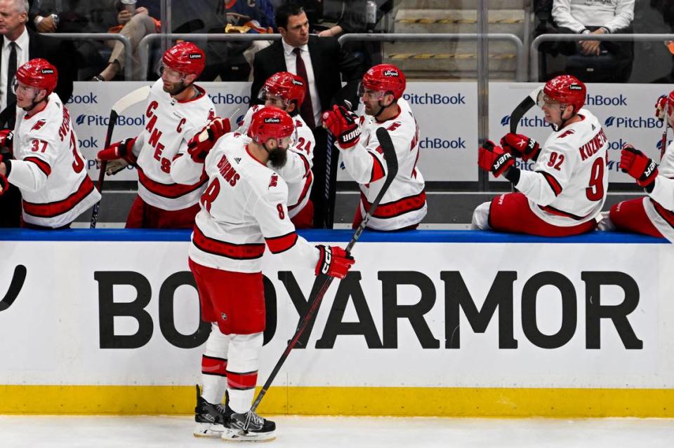 Apr 25, 2024; Elmont, New York, USA; Carolina Hurricanes defenseman Brent Burns (8) celebrates his goal against the New York Islanders during the first period in game three of the first round of the 2024 Stanley Cup Playoffs at UBS Arena. Mandatory Credit: Dennis Schneidler-USA TODAY Sports