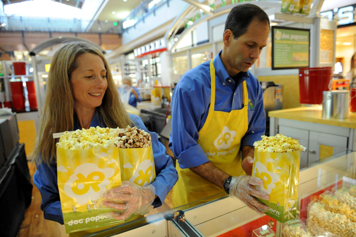 Founders and owners of Doc Popcorn Renee Israel, left and her husband Rob Israel, are shown at their popcorn stand at Flatirons Mall in Broomfield. Their local company, which they say was started in Boulder, is now in 22 other states. Helen H. Richardson, The Denver Post  (Photo By Helen H. Richardson/The Denver Post via Getty Images)