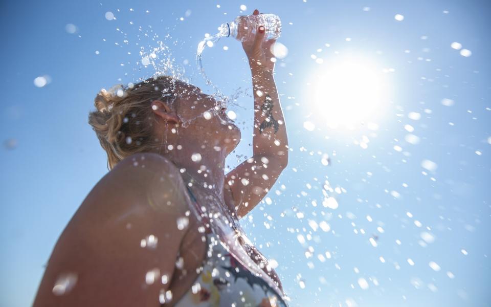 If you have no shelter, soak your clothes with water and drink small sips to rehydrate