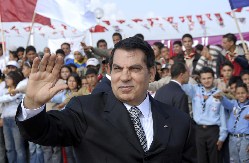 FILE - In this Nov.7, 2007 file photo, Tunisian President Zine EL Abidine Ben Ali waves to supporters in Rades, outside Tunis, before celebrations marking the 20th anniversary of Ben Ali's presidency. Tunisia's autocratic ruler Zine El Abidine Ben Ali, toppled in 2011, died in exile in Saudi Arabia. (AP Photo/Hassene Dridi, File)