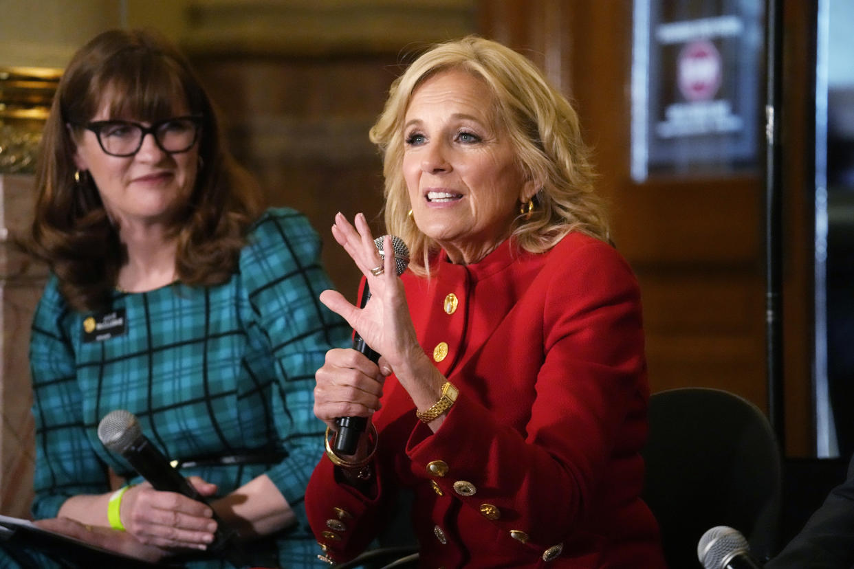 First lady Jill Biden, front, makes a point as Colorado Speaker of the House Julie McCluskie looks on during a stop to attend a roundtable discussion on the federal workforce training program to help community college students earn certificates for entry-level jobs Monday, April 3, 2023, inside the State Capitol in Denver. Both Republican and Democratic state lawmakers were on hand for the first lady's visit, the first of four stops across the country to promote the Biden Administration's effort to invest in America. (AP Photo/David Zalubowski)