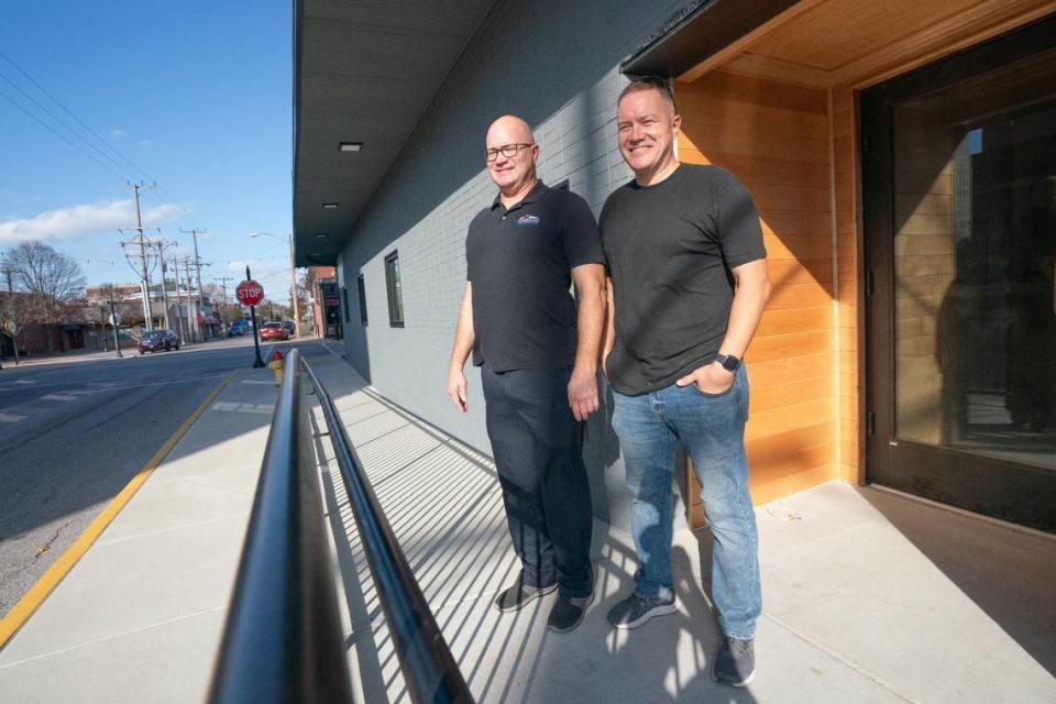 Vic and Karl Gilpin stand in front of their building at 300 E. Main St., which will soon be host to upscale apartments in addition to an already operating commercial firm in downtown Belleville.