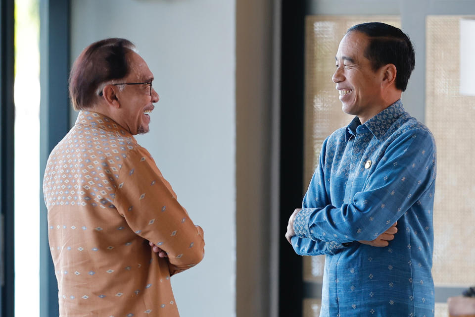 Indonesian President Joko Widodo, right, talks with Malaysian Prime Minister Anwar Ibrahim prior to the 15th Indonesia-Malaysia-Thailand Growth Triangle (IMT-GT) Summit on the sidelines of the 42nd ASEAN Summit in Labuan Bajo, East Nusa Tenggara province, Indonesia, Thursday, May 11, 2023. (Willy Kurniawan/Pool Photo via AP)