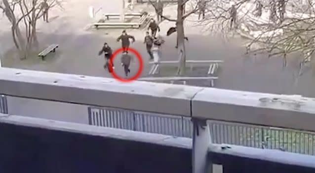 The man was captured on video running out of the school after being chased by a group of students. Source: LiveLeak