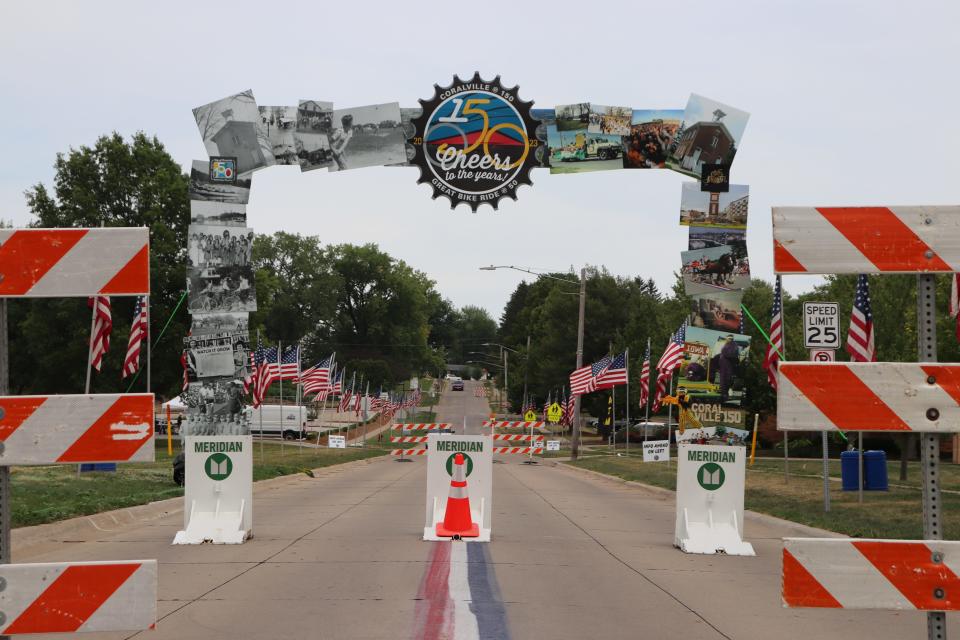 The welcome archway, featuring historic photos of Coralville as it celebrates both 150 years as a city and 50 years of RAGBRAI, was set up along Eighth Street on Thursday, July 27, 2023.