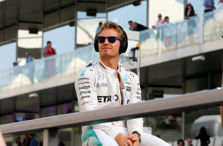 Formula One - F1 - Abu Dhabi Grand Prix - Yas Marina Circuit, Abu Dhabi, United Arab Emirates - 27/11/2016 - Mercedes' Formula One driver, Nico Rosberg of Germany smiles at his fans during driver's parade. REUTERS/Hamad I Mohammed