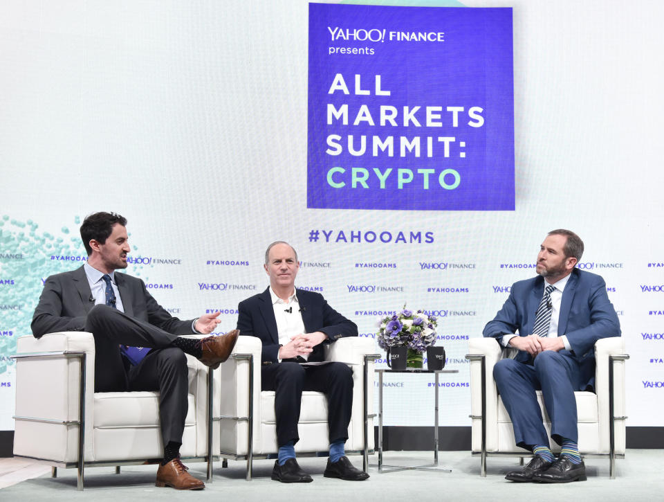 Talking crypto: Dan Roberts, Brad Garlinghouse, and Andy Serwer attend the Yahoo Finance All Markets Summit: Crypto on February 7, 2018 in New York City. Photo: Eugene Gologursky/Getty Images for Yahoo Finance/Oath.