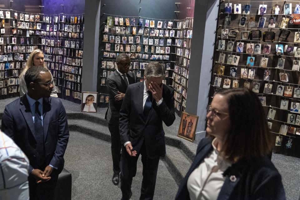 Secretary of State Antony Blinken, center, accompanied by Rwanda's Minister of Foreign Affairs Vincent Biruta, center left, visits the Kigali Genocide Memorial in Kigali, Rwanda, Thursday, Aug. 11, 2022. Blinken is on a ten day trip to Cambodia, Philippines, South Africa, Congo, and Rwanda. (AP Photo/Andrew Harnik, Pool)