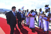 In this handout photo provided by the Indian Ministry of External Affairs, Chinese President Xi Jinping is received upon arrival in Chennai, India, Friday, Oct. 11, 2019. Xi arrived in India Friday for a summit with Prime Minister Narendra Modi at a time of tensions over Beijing joining Pakistan in opposing India’s downgrading of Kashmir’s autonomy and the ongoing lockdown in the disputed region. (Indian Ministry of External Affairs via AP Photo)