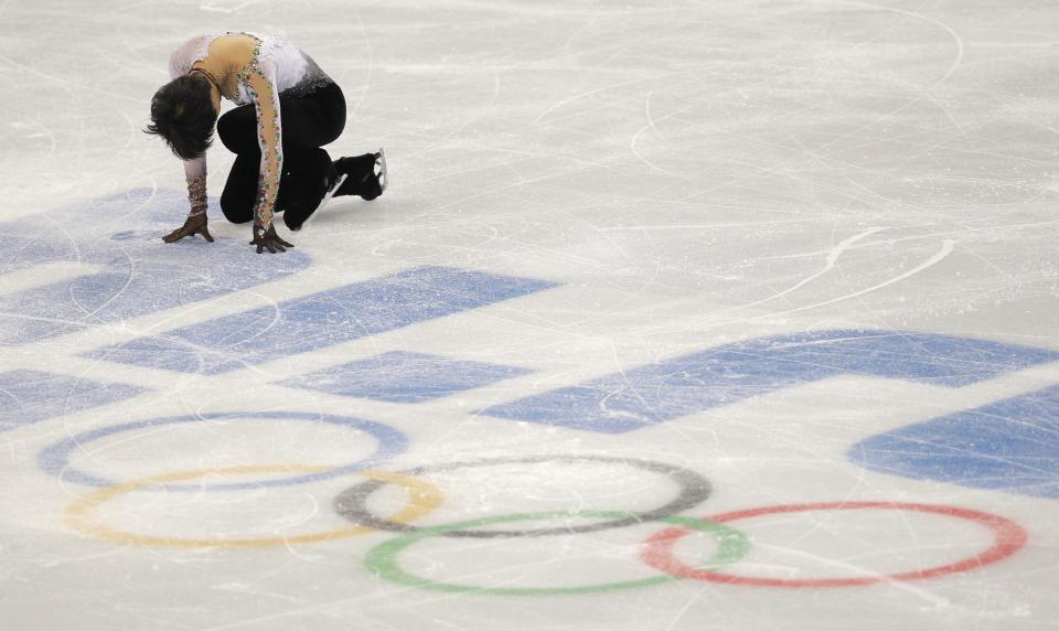 Yuzuru Hanyu of Japan completes his routine in the men's free skate figure skating final at the Iceberg Skating Palace during the 2014 Winter Olympics, Friday, Feb. 14, 2014, in Sochi, Russia. (AP Photo/Vadim Ghirda)