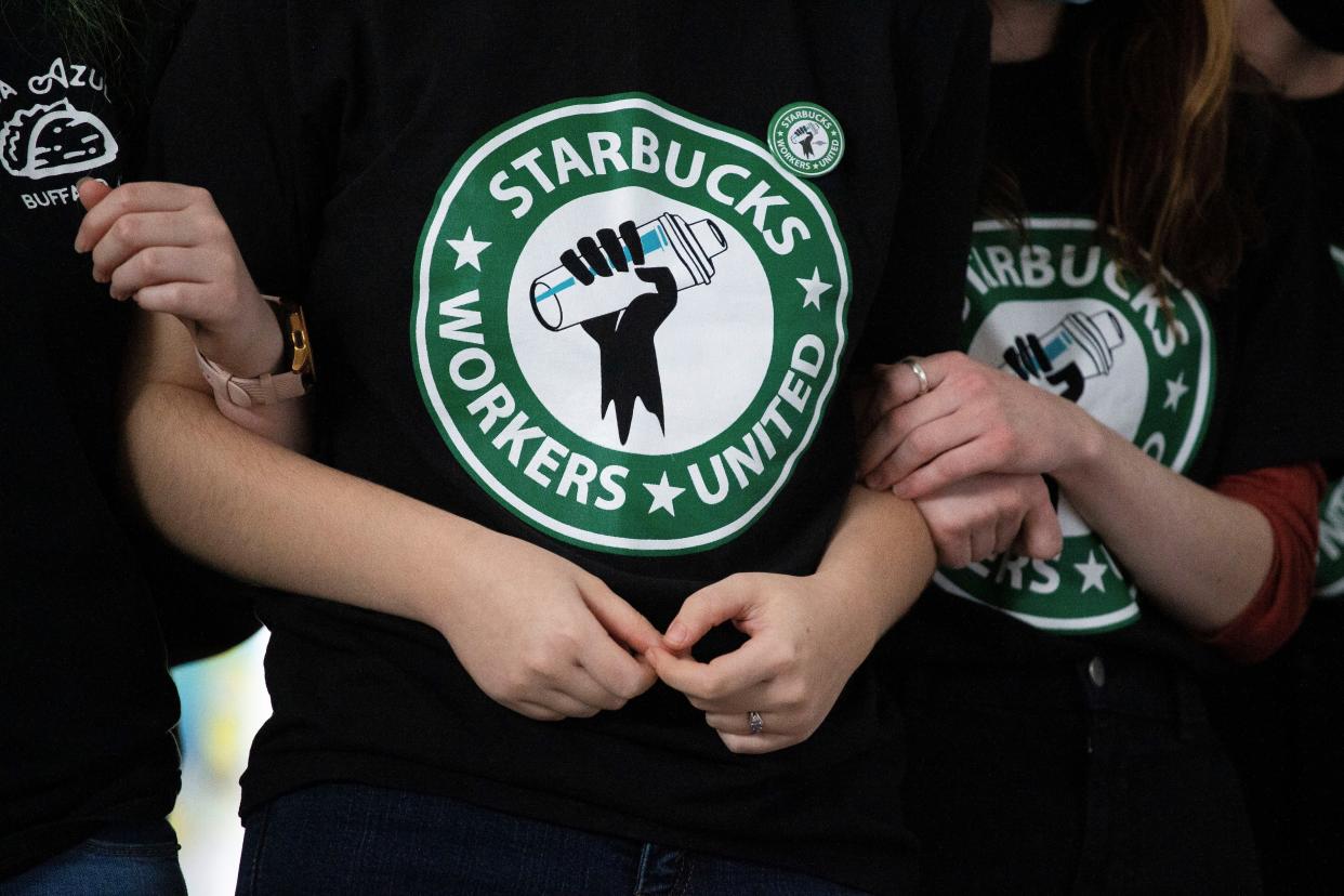 Starbucks employees and supporters react as votes are read during a union-election watch party on Thursday, Dec. 9, 2021, in Buffalo, N.Y.  