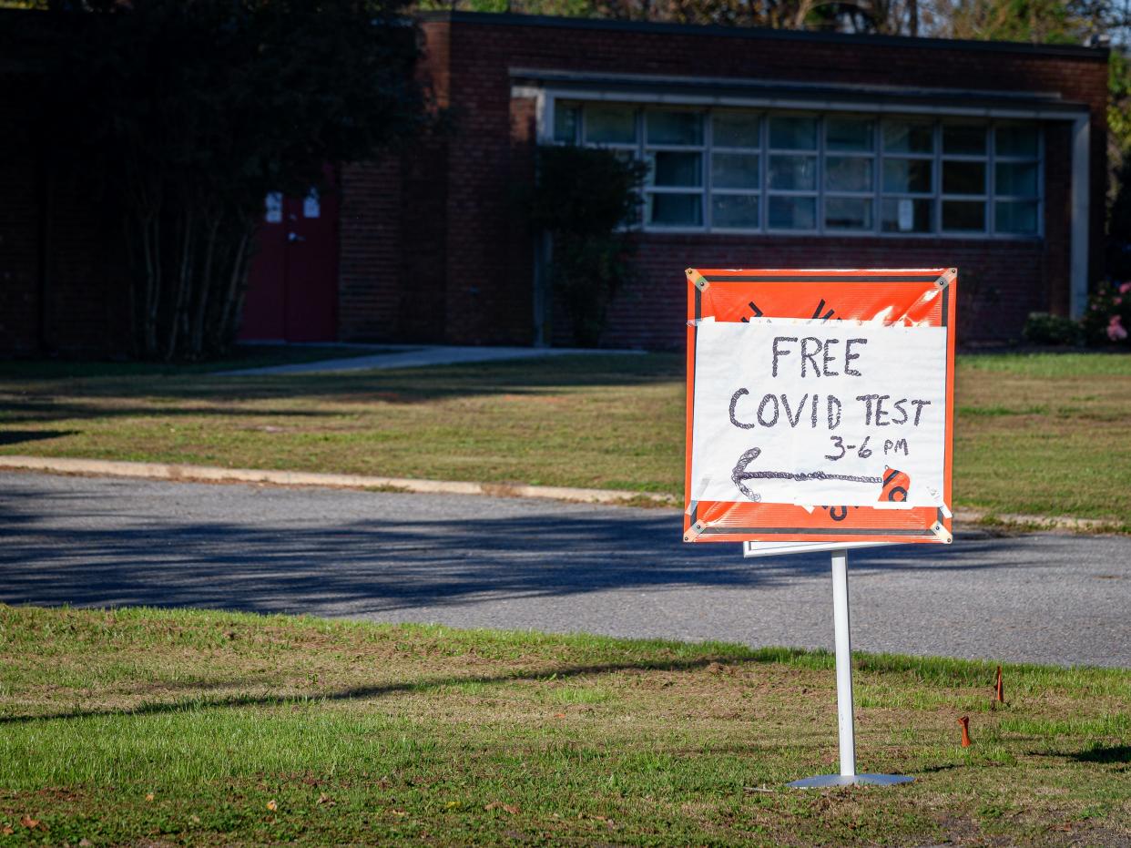 A sign offers free drive-thru COVID-19 tests Nov. 9, 2021, in Accomac.