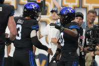 BYU quarterback Jaren Hall (3), celebrates after wide receiver Kody Epps (0) scored a touchdown against Notre Dame during the first half of an NCAA college football game Saturday, Oct. 8, 2022, in Las Vegas. (AP Photo/John Locher)