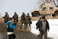 Protesters evacuate the main opposition camp against the Dakota Access oil pipeline near Cannon Ball, North Dakota, U.S., February 23, 2017. REUTERS/Terray Sylvester