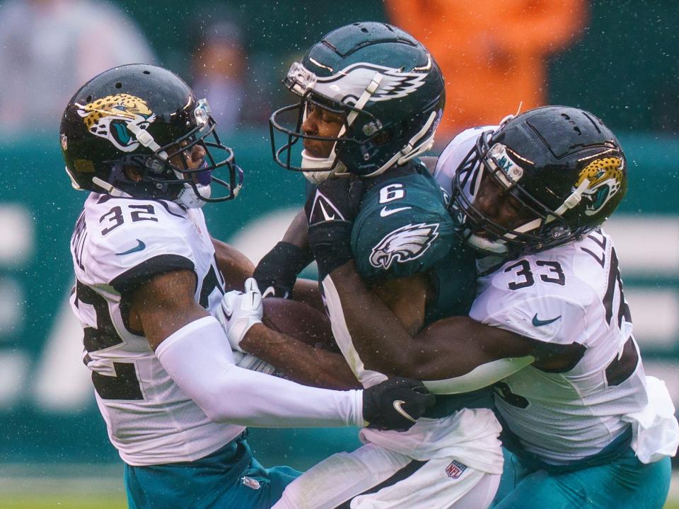 Devin Lloyd makes a tackle against the Philadelphia Eagles.