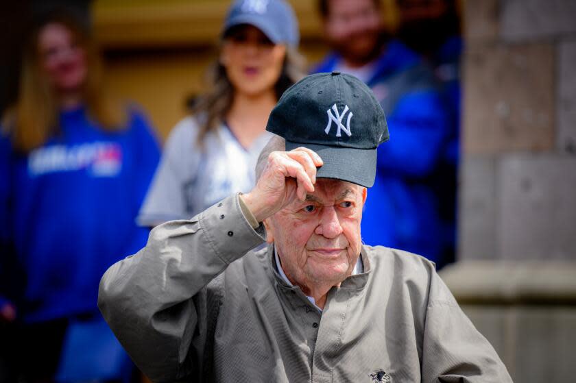 SONOMA, CALIFORNIA - APRIL 25: Art Schallock, the oldest living former MLB player, tips his hat during a 100th birthday bash at Cogir on Napa Road Assisted Living on Thursday, April 25, 2024 in Sonoma, California. Schallock pitched for three NY Yankees World Series champions in the 1950s, was a roommate of Yogi Berra and has great stories about Mickey Mantle, Casey Stengel and others. (Josh Edelson / For the Times)