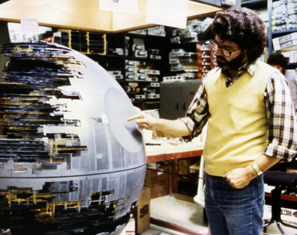 American director, screenwriter and producer George Lucas looks at the Death Star from Return of the Jedi. (Photo by Sunset Boulevard/Corbis via Getty Images)