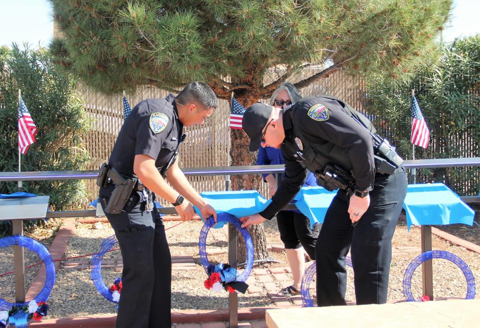 Two Alamogordo Police Officers place a wreath at the Alamogordo Fallen Officer Memorial May 14, 2022.

A fallen officer memorial was held at Alamogordo's Fallen Officer Memorial Park on 10th Street on May 14, 2022.