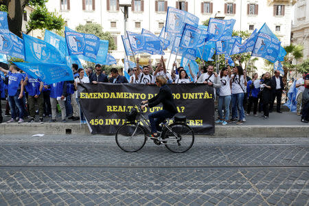 People, aspiring prison guards, protest in front of the Justice Ministery building in downtown Rome, Italy May 23, 2016. Reuters/Tony Gentile