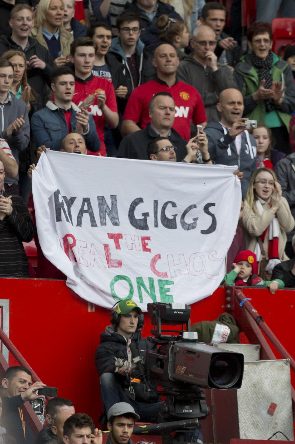 A Manchester United supporters hold a banner in support of of interim manager Ryan Giggs before the team's English Premier League soccer match against Norwich City at Old Trafford Stadium, Manchester, England, Saturday April 26, 2014. (AP Photo/Jon Super)