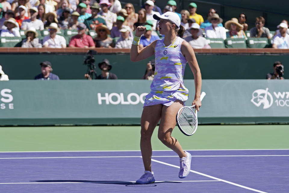 Iga Swiatek, of Poland, reacts during the women's singles finals against Maria Sakkari, of Greece, at the BNP Paribas Open tennis tournament Sunday, March 20, 2022, in Indian Wells, Calif. (AP Photo/Marcio Jose Sanchez)