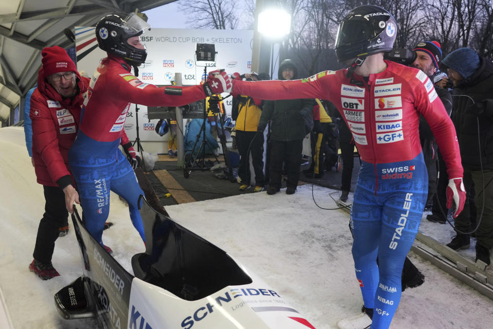 Second placed Michael Vogt and Sandro Michel of Switzerland finish after their second run of the two-man Bobsleigh World Cup race in Sigulda, Latvia, Saturday, Feb. 3, 2024. (AP Photo/Oksana Dzadan)