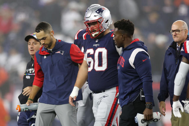 Patriots captain David Andrews helped to locker room after leg injury