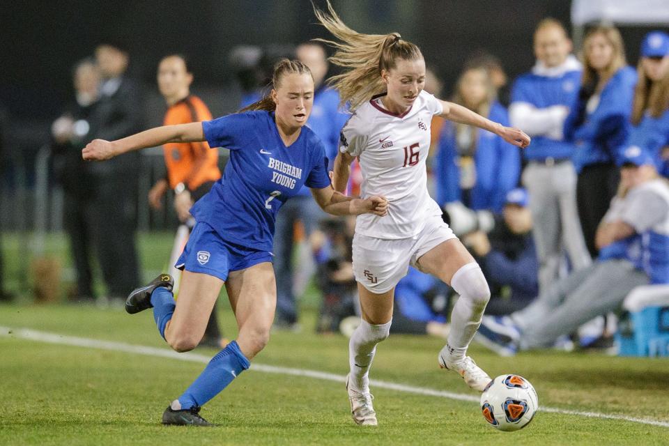 Florida State Seminoles Gabby Carle (16) battles an opponent to keep possession of the ball. The Florida State Seminoles defeated the Brigham Young Cougars 4-3 with penalty kicks after two scoreless overtimes during the NCAA Championship game in Santa Clara, California on Monday, Dec. 6, 2021.