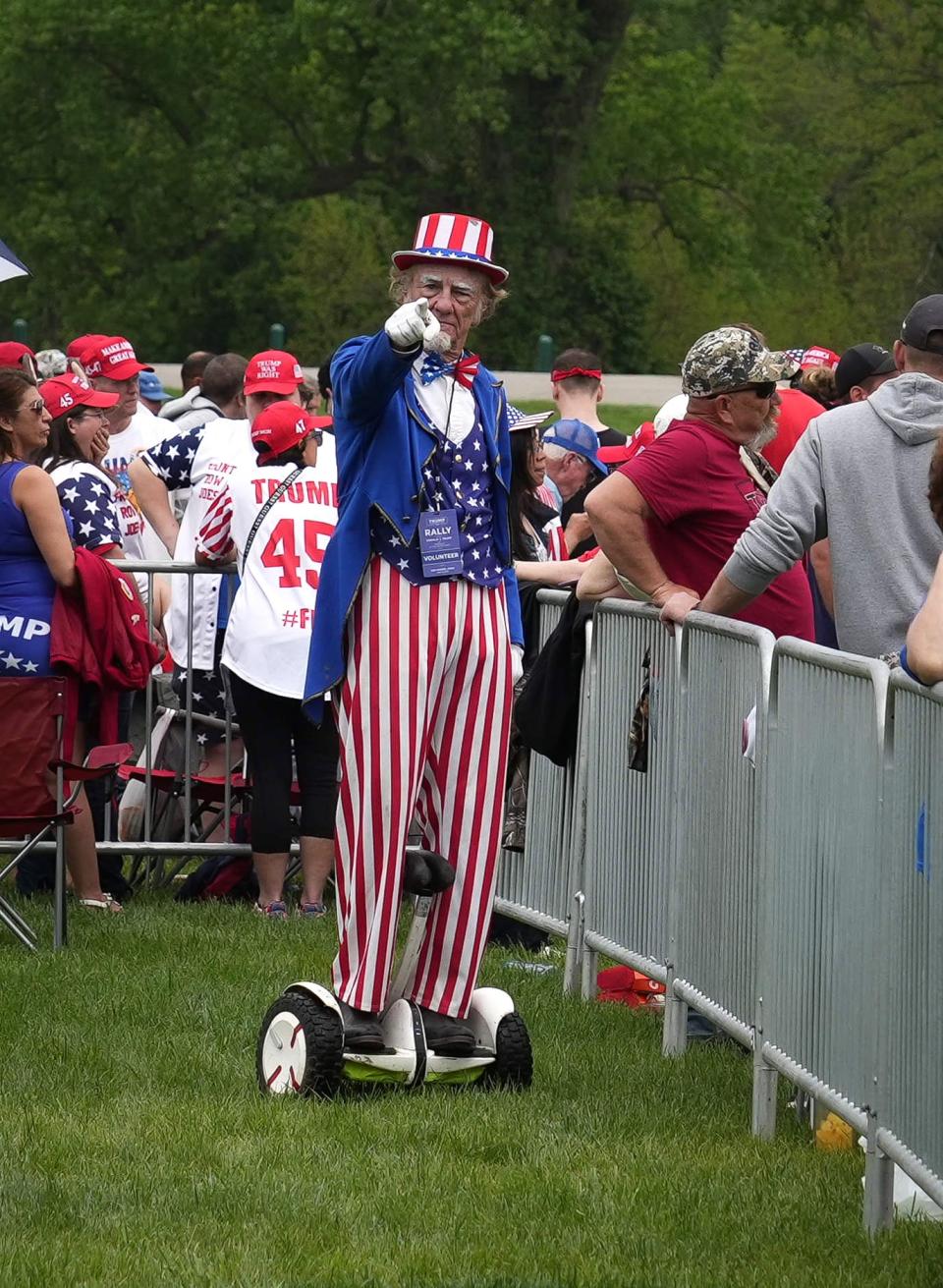 Supporters of former President Donald Trump line up hours before a rally on Saturday, May 13, 2023, at Water Works Park in Des Moines, Iowa.