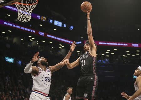 Apr 18, 2019; Brooklyn, NY, USA; Brooklyn Nets center Jarrett Allen (31) shoots against Philadelphia 76ers forward Greg Monroe (55) in the third quarter in game three of the first round of the 2019 NBA Playoffs at Barclays Center. Mandatory Credit: Wendell Cruz-USA TODAY Sports