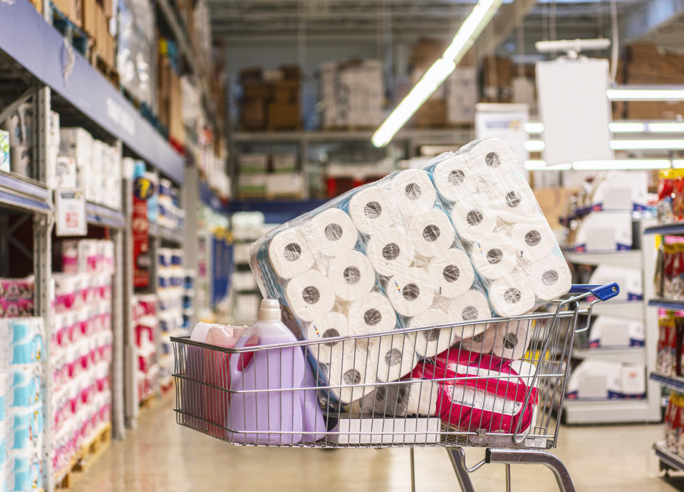 Shopping cart full with products in a large supermarket