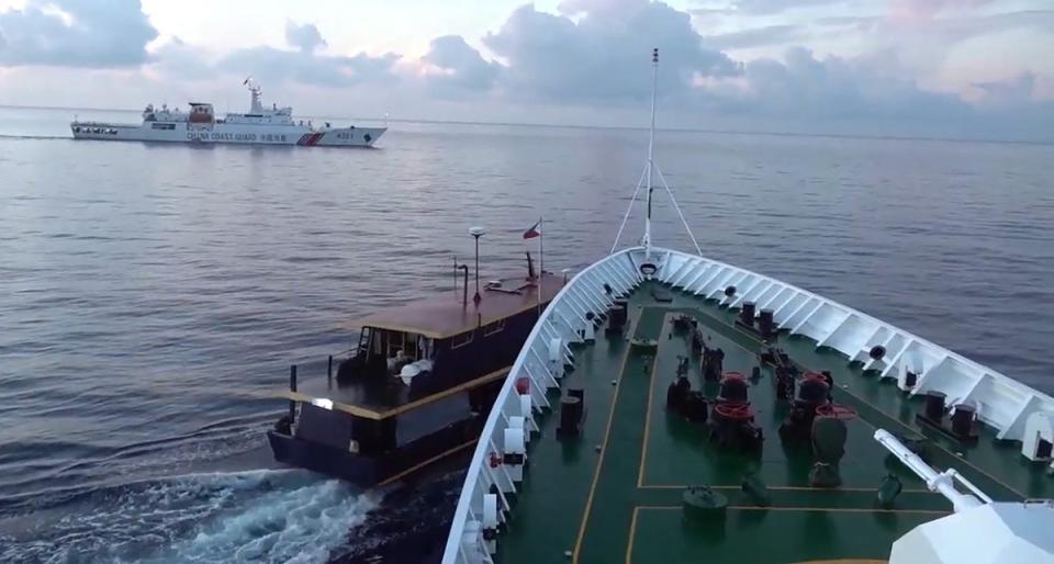 In this video grab taken from a video released by the Chinese Coast Guard (CCG) through the Chinese embassy in Manila on 23 October 2023 shows a collision between Chinese Coast Guard ship (R) and Philippines’ resupply boat (L) during a resupply mission in Second Thomas Shoal (Chinese Coast Guard /AFP via Get)